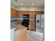 Well-equipped kitchen with stainless steel appliances and ample cabinetry at 1754 Fritwell Ct, Ocoee, FL 34761