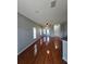 Open concept living room featuring hardwood flooring, natural light, and ceiling fan at 1754 Fritwell Ct, Ocoee, FL 34761