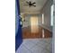Bright living room featuring hardwood floors and sliding door access to backyard at 1754 Fritwell Ct, Ocoee, FL 34761