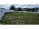 Spacious backyard with a partial white picket fence, and plenty of room for outdoor activities and relaxation at 1858 Snapper Dr, Poinciana, FL 34759