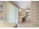 Bathroom view showcases vanity with storage and the access door to the backyard pool at 1947 Broadleaf Ct, Windermere, FL 34786