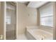 Bright bathroom showcasing a separate shower and a soaking tub for relaxation at 1947 Broadleaf Ct, Windermere, FL 34786