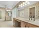 Bathroom featuring dual sinks, vanity with storage and a dressing table area for added convenience at 1947 Broadleaf Ct, Windermere, FL 34786