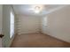 Bedroom with neutral carpet and white shelving, providing ample storage at 1947 Broadleaf Ct, Windermere, FL 34786
