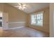 Bright bedroom with tile floors, a large window, and neutral walls at 1947 Broadleaf Ct, Windermere, FL 34786