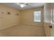 Bedroom with neutral carpeting, yellow dot wallpaper, and a window at 1947 Broadleaf Ct, Windermere, FL 34786
