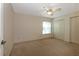 Neutral bedroom featuring carpet floors, a ceiling fan, and a window with blinds at 1947 Broadleaf Ct, Windermere, FL 34786