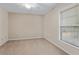 Bright bedroom featuring neutral walls, carpet, ceiling fan, and window at 1947 Broadleaf Ct, Windermere, FL 34786