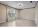 Neutral bedroom with tiled floors, large window, and decorative trim at 1947 Broadleaf Ct, Windermere, FL 34786