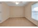 Bright bedroom with neutral carpet and a window letting in natural light at 1947 Broadleaf Ct, Windermere, FL 34786