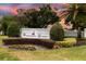 Entrance to the Windermere Downs community with manicured landscaping, making a great first impression at 1947 Broadleaf Ct, Windermere, FL 34786