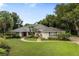Charming single-story home with manicured lawn and mature trees in a desirable neighborhood at 1947 Broadleaf Ct, Windermere, FL 34786