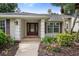 Inviting front entrance with decorative door and well-maintained landscaping at 1947 Broadleaf Ct, Windermere, FL 34786