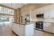 Stylish kitchen featuring granite countertops, stainless steel appliances, and a center island at 1947 Broadleaf Ct, Windermere, FL 34786