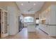 Beautiful kitchen with stainless steel appliances, an island, and bright white custom cabinets at 1947 Broadleaf Ct, Windermere, FL 34786