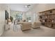 Spacious living room with neutral decor and lots of natural light at 1947 Broadleaf Ct, Windermere, FL 34786