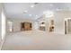 Spacious living room features vaulted ceilings, neutral carpet, bar area, and lots of natural light at 1947 Broadleaf Ct, Windermere, FL 34786
