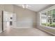Open floor plan with tile flooring and large window providing ample natural light at 1947 Broadleaf Ct, Windermere, FL 34786