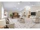 Spacious living room features vaulted ceilings, neutral carpet, bar area, and billiards table at 1947 Broadleaf Ct, Windermere, FL 34786
