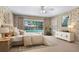 Staged main bedroom with sliding door to pool, and neutral decor at 1947 Broadleaf Ct, Windermere, FL 34786