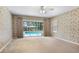 Spacious main bedroom with a sliding glass door out to the pool at 1947 Broadleaf Ct, Windermere, FL 34786