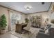 Cozy home office featuring a desk, bookshelves, and comfortable seating at 1947 Broadleaf Ct, Windermere, FL 34786