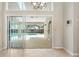 View of screened patio and pool area from inside the home, featuring tile floors at 1947 Broadleaf Ct, Windermere, FL 34786