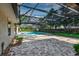 Large screened-in pool and brick paver patio perfect for outdoor entertaining at 1947 Broadleaf Ct, Windermere, FL 34786