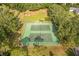 Aerial view of community tennis courts, a recreational amenity for residents at 1947 Broadleaf Ct, Windermere, FL 34786