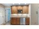 Charming wet bar featuring wood cabinetry, a mini fridge, and built in microwave at 1947 Broadleaf Ct, Windermere, FL 34786