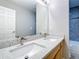 Bathroom with double sinks and granite countertops and modern fixtures at 2124 Fish Eagle St, Clermont, FL 34714