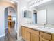 Bathroom with double sinks and a granite countertop at 2124 Fish Eagle St, Clermont, FL 34714