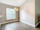 Cozy dining area with stylish lighting, a window, and wood-style floors at 2124 Fish Eagle St, Clermont, FL 34714