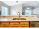 Modern kitchen with granite counters, ample maple cabinets, and stainless steel sink at 2124 Fish Eagle St, Clermont, FL 34714