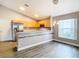 Stylish kitchen with stainless steel appliances, maple cabinets, and tile backsplash at 2124 Fish Eagle St, Clermont, FL 34714