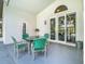 A covered patio features a table and chairs set, great for outdoor dining and relaxation at 2124 Fish Eagle St, Clermont, FL 34714
