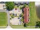 Overhead view of a complex with a parking lot, showcasing the building's layout and location at 214 Majors Ln # C, Kissimmee, FL 34743