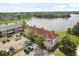 Attractive aerial perspective of a building next to a scenic lake with parking at 214 Majors Ln # C, Kissimmee, FL 34743