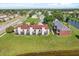 Aerial shot of buildings by the lake showing the serene community and well-maintained grounds at 214 Majors Ln # C, Kissimmee, FL 34743