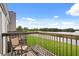 Balcony featuring a wooden deck, railing, chair, and view of the lake at 214 Majors Ln # C, Kissimmee, FL 34743