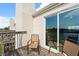 Balcony featuring 2 chairs, a wooden deck, and a slider door to the interior at 214 Majors Ln # C, Kissimmee, FL 34743