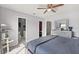 Primary bedroom with views to bathroom, closet and a dresser with mirror at 214 Majors Ln # C, Kissimmee, FL 34743