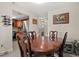 Dining room featuring a wooden table and chairs, tile floors, and kitchen access at 214 Majors Ln # C, Kissimmee, FL 34743