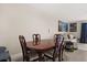 Dining room with a wood table set, tile floors, and open to the living area at 214 Majors Ln # C, Kissimmee, FL 34743