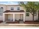 Charming two-story townhouse featuring a covered front porch and well-maintained landscaping at 214 Majors Ln # C, Kissimmee, FL 34743