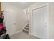 Bright foyer with tile flooring, stairway, and doors leading to other areas of the home at 214 Majors Ln # C, Kissimmee, FL 34743