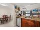 Kitchen with stainless steel appliances, granite countertops and adjacent dining and living areas at 214 Majors Ln # C, Kissimmee, FL 34743