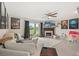 Cozy living room featuring a fireplace, tile flooring, and sliding glass doors to the patio at 214 Majors Ln # C, Kissimmee, FL 34743