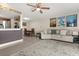 Spacious living room with tile flooring, a ceiling fan, and ample natural light at 214 Majors Ln # C, Kissimmee, FL 34743