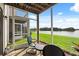 Relaxing patio with a stunning lake view, perfect for enjoying outdoor living and entertaining guests at 214 Majors Ln # C, Kissimmee, FL 34743